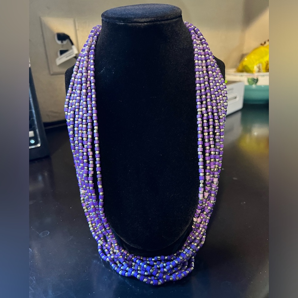 Multi Strand purple and silver beaded necklace. Different shades of purple.